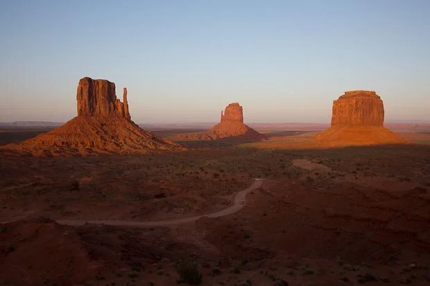 A Beautiful Sunset Lights Up The Pillars Of Monument Valley In Utah