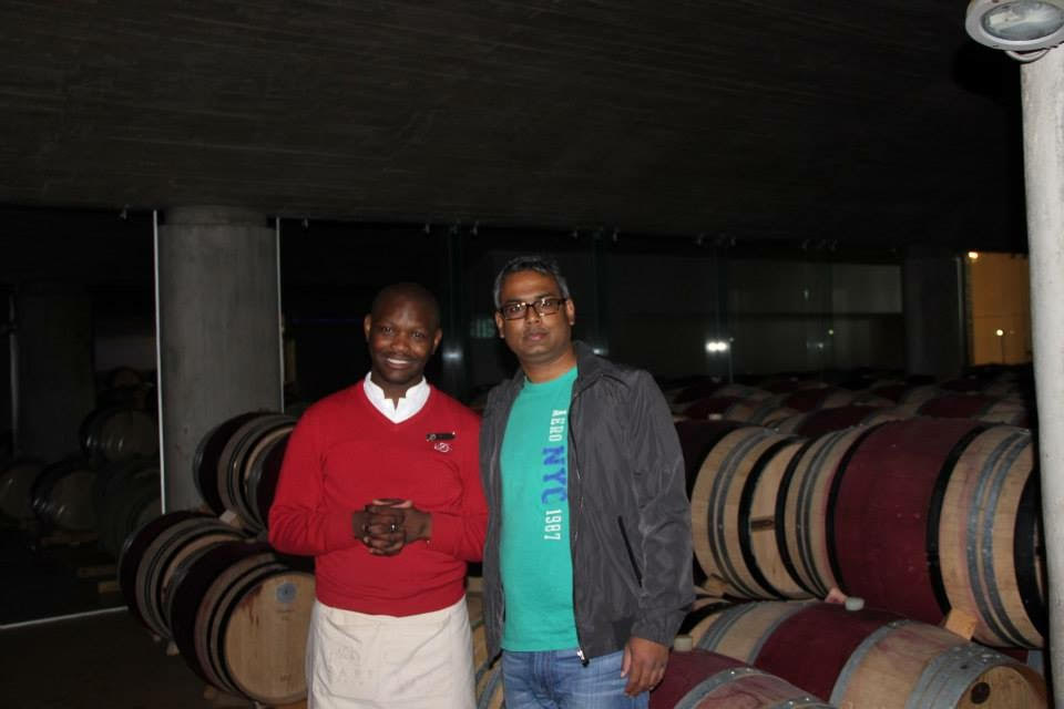 Hubby dear in front of wine maturing in barrels 