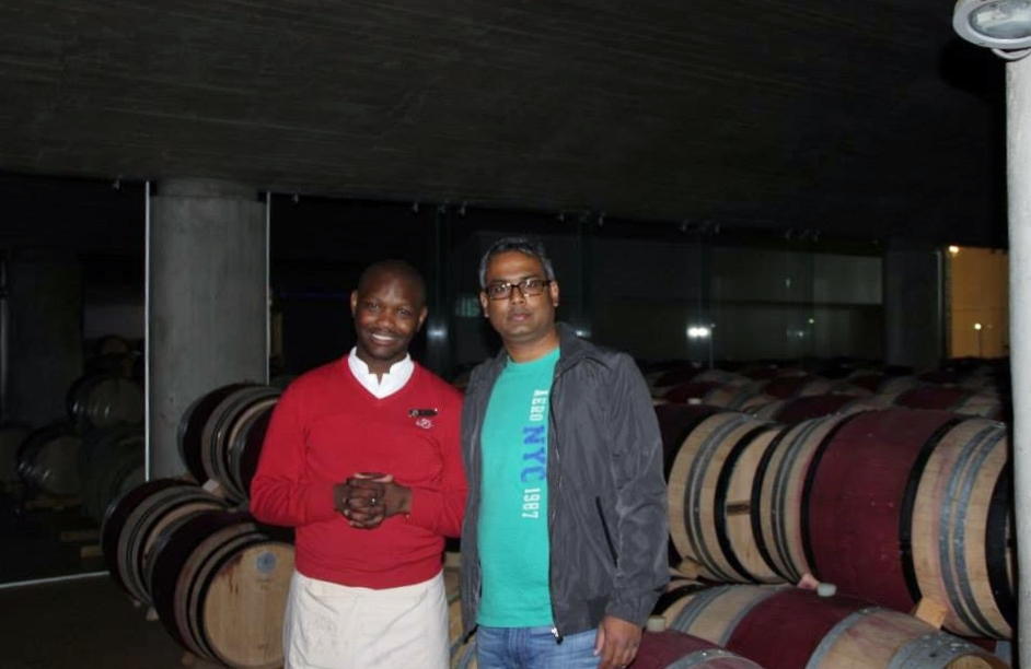 Hubby dear in front of wines maturing in barrels