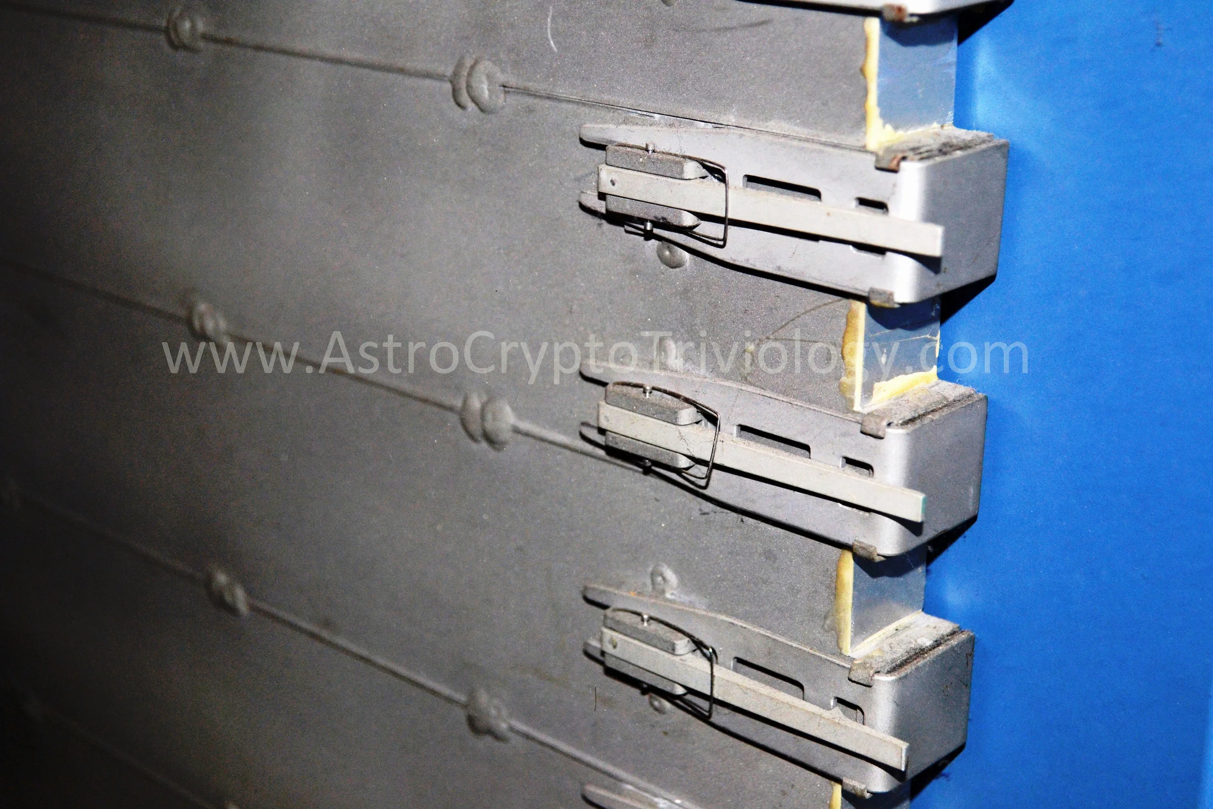 Detail of clips apparently intended to hold food and beverage bags until needed. (Photo credit: J.B. Charles, October 23, 2015).