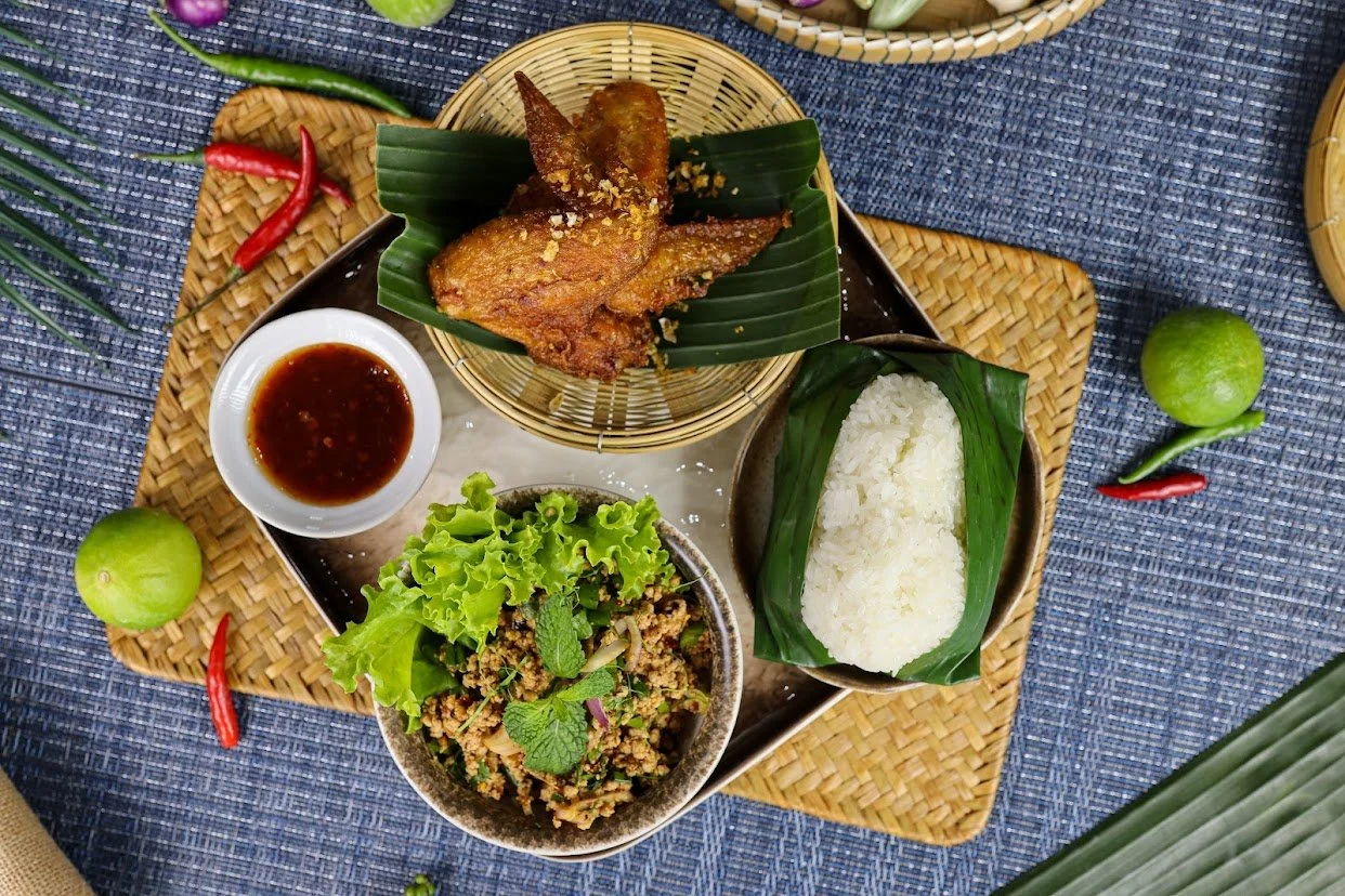 I2. LARB MOO SET MEAL 🌶️🌶️ (F) This is an all time favourite Thai dish. Minced pork seasoned with chillies, lime juice, ground roasted sticky rice and fresh herbs, served with HAT-YAI fried chicken wings and sticky rice