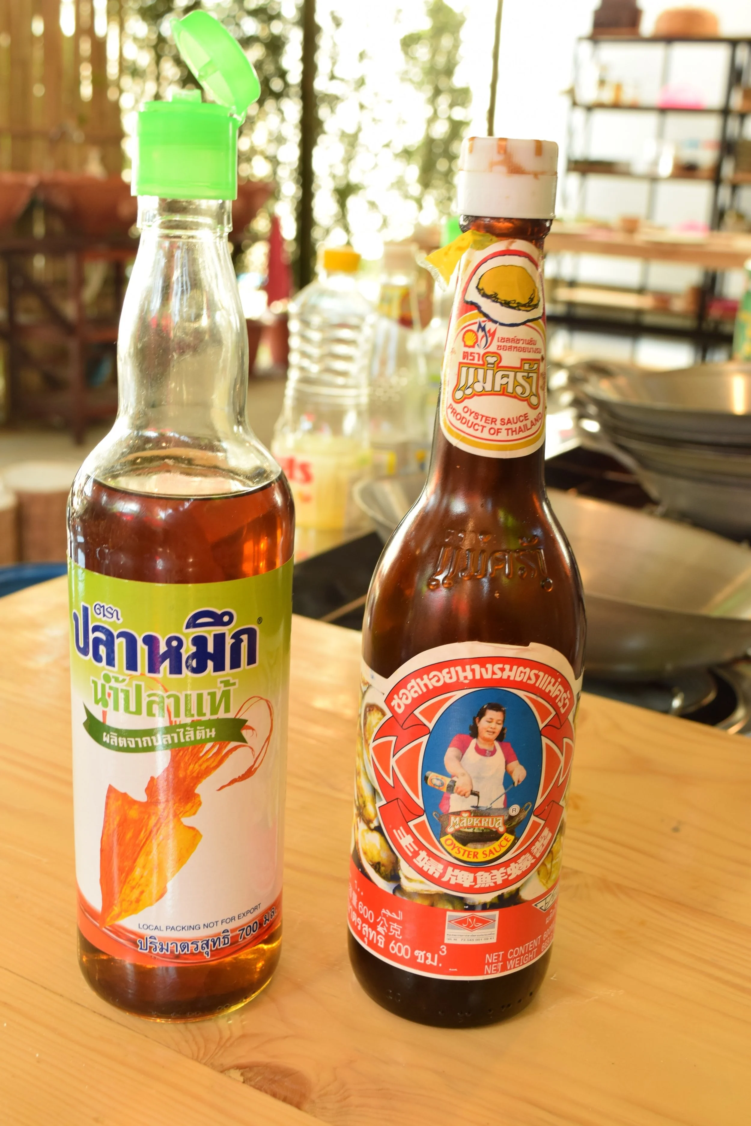 Fish sauce on the left, and oyster sauce on the right