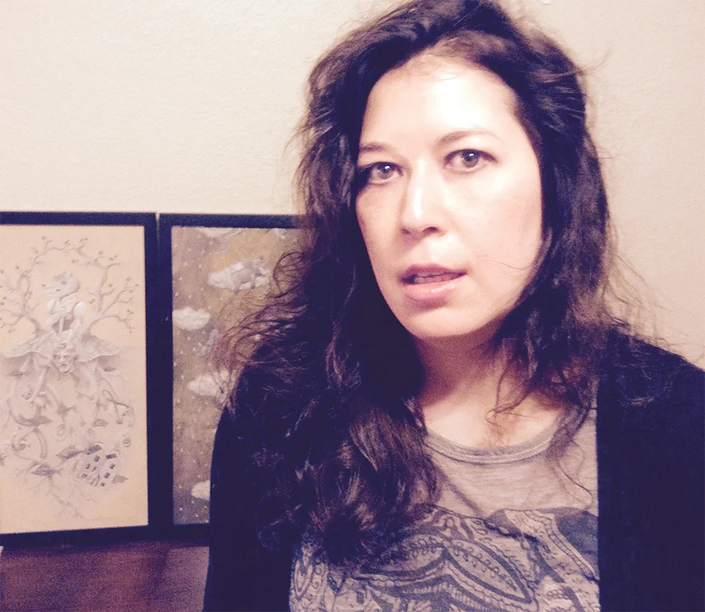 Me in my art studio with my paintings in the background. I needed RADICAL change and Sex & Intimacy Coach, Sophia Treyger helped me do that in all aspects of my life including my art.