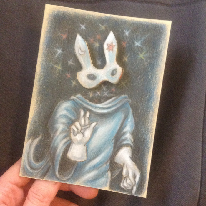 The finished color pencil drawing of the Invisible Ghost Bunny with his mask on.