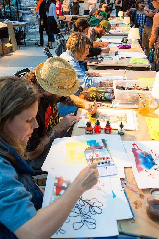 One row of the many artists creating at the Monster Drawing Rally at the Portland Art Museum.