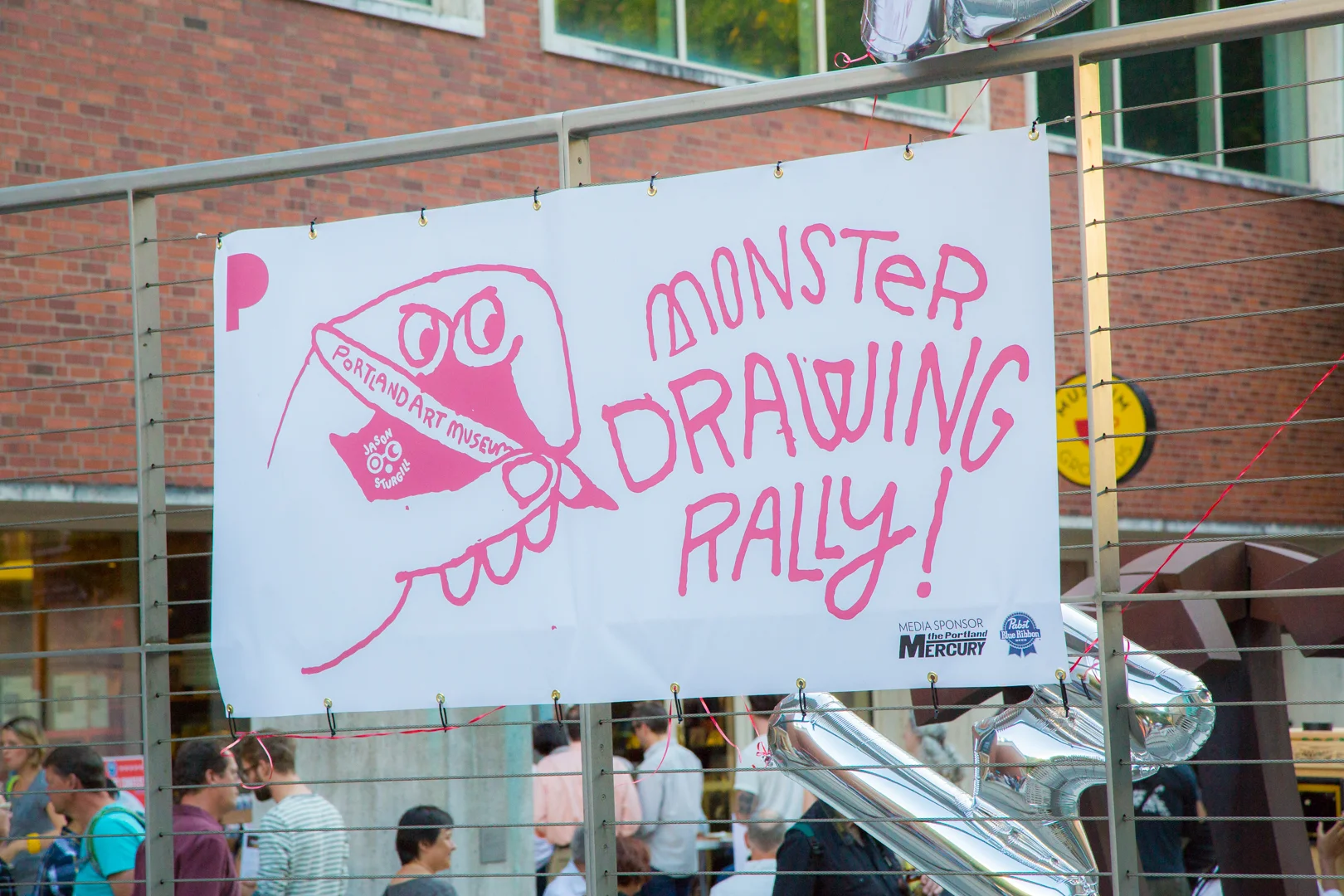 The Monster Drawing Rally sign at the Portland Art Museum.