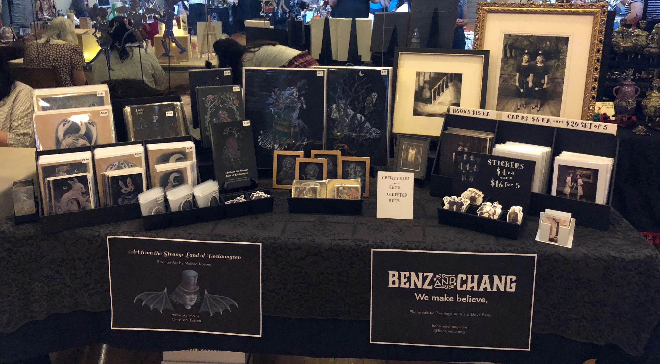Our artist tables with our signs and art displayed attractively, ready for the onslaught of customers.