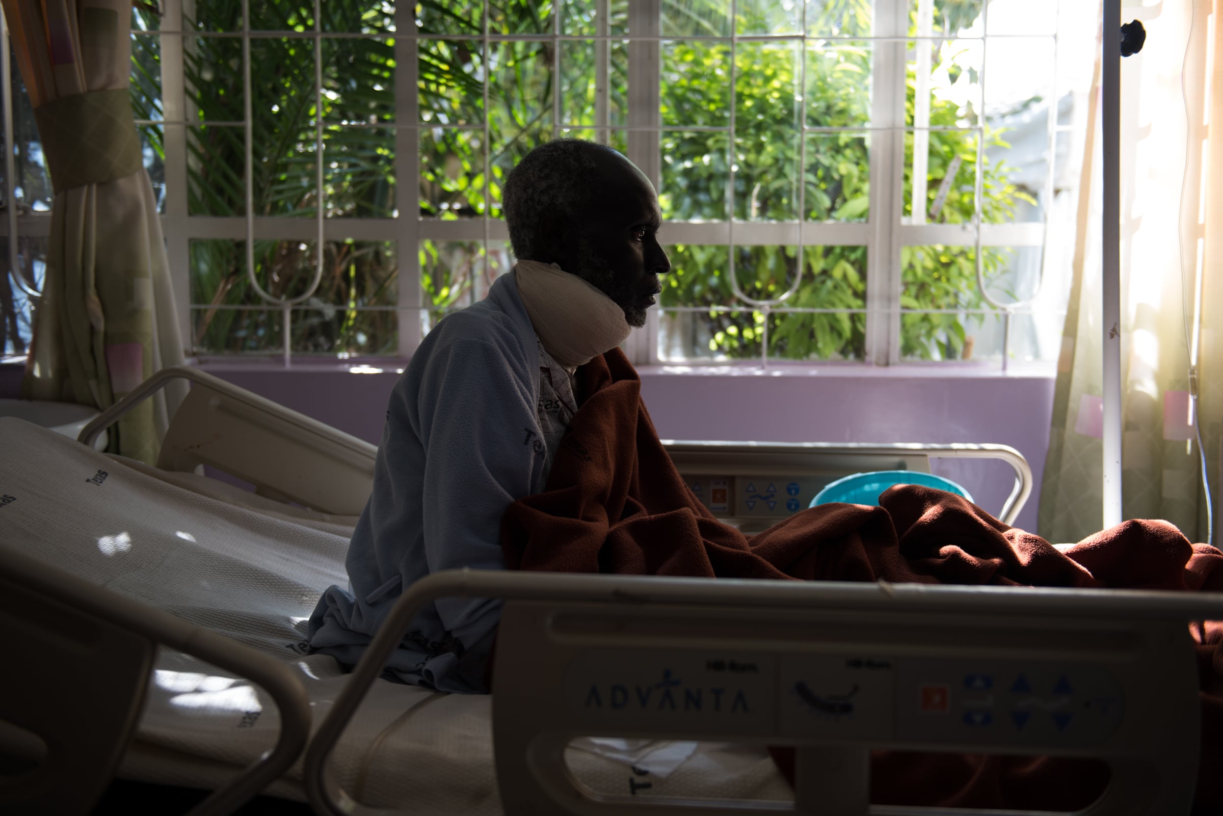 Samwell Mosota Omaiyo sits up in his bed on Sunday afternoon at the Texas Cancer Centre in-patient facility in Nairobi, Kenya on Sunday, Aug. 23, 2015. Nurses here are trained in palliative care and give round the clock care to over a dozen patients in this small medical building. 