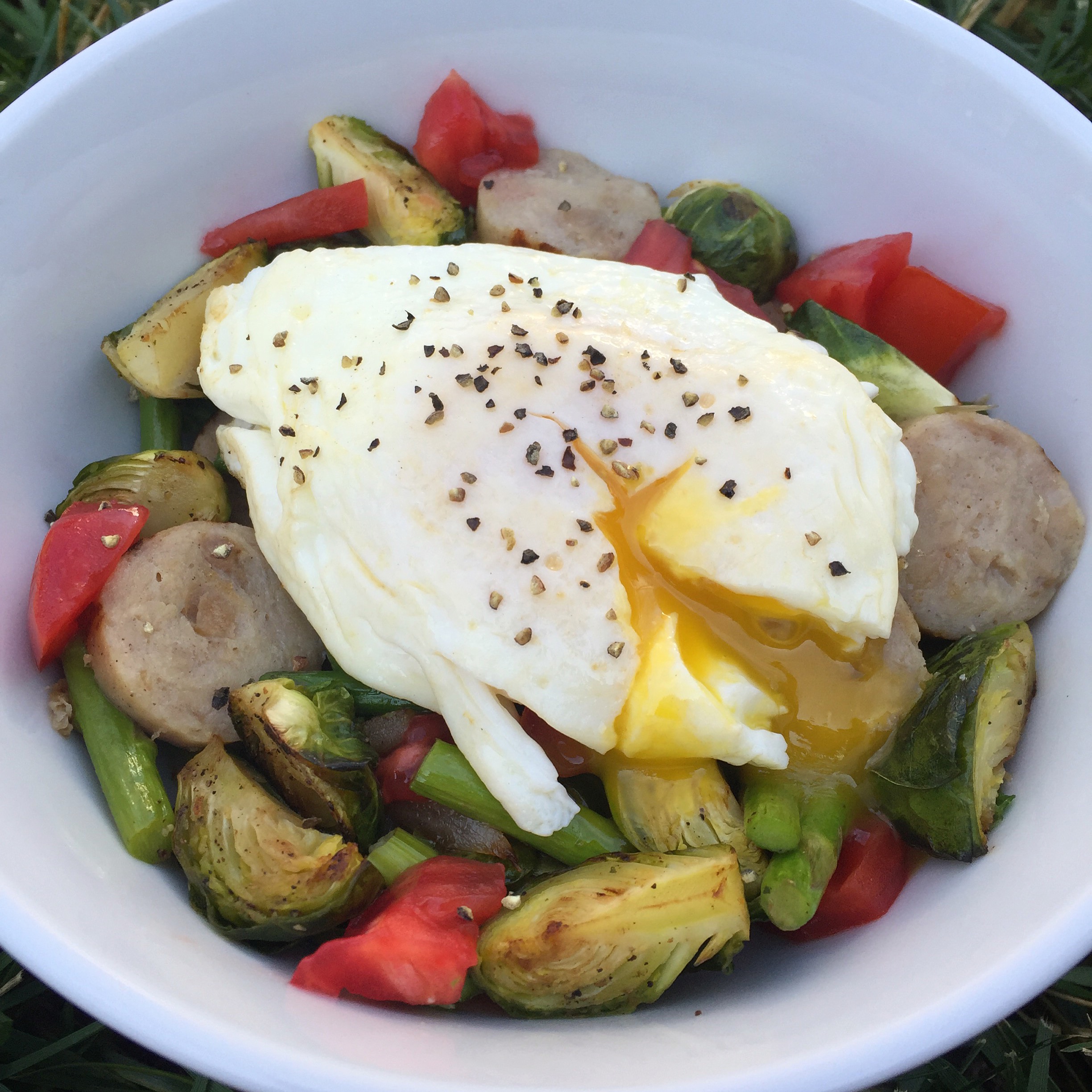 This particular day my egg bowl was filled with potatoes and spinach on the bottom, topped with leftover roasted asparagus and brussel sprouts, onions, a chicken sausage from Trader Joe's, tomatoes, a runny egg, salt/pepper, and a dollop of cottage cheese after I took the picture.