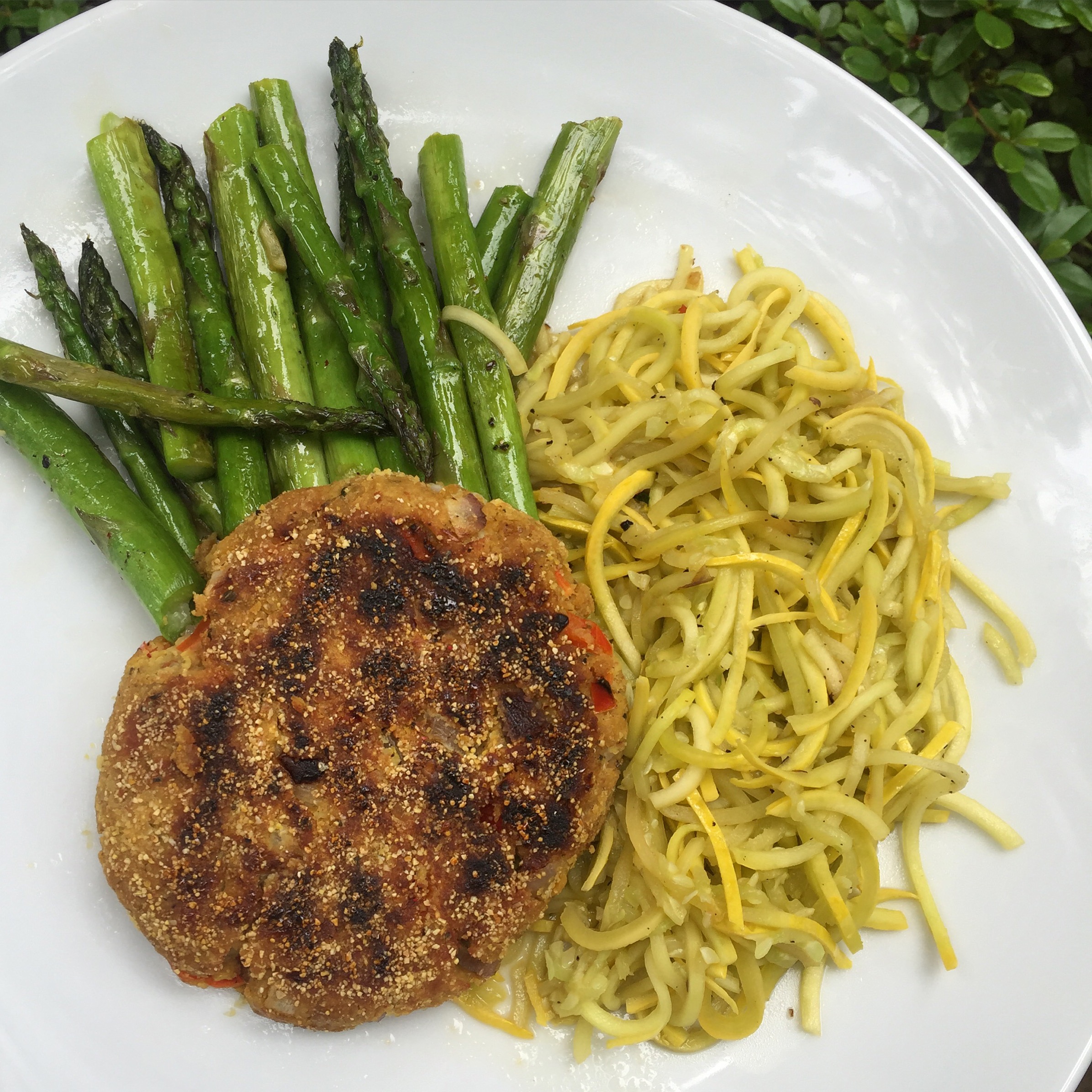 Chickpea-bean veggie burger + sautéed spiralized yellow squash + sautéed asparagus in coconut oil spray and coconut aminos