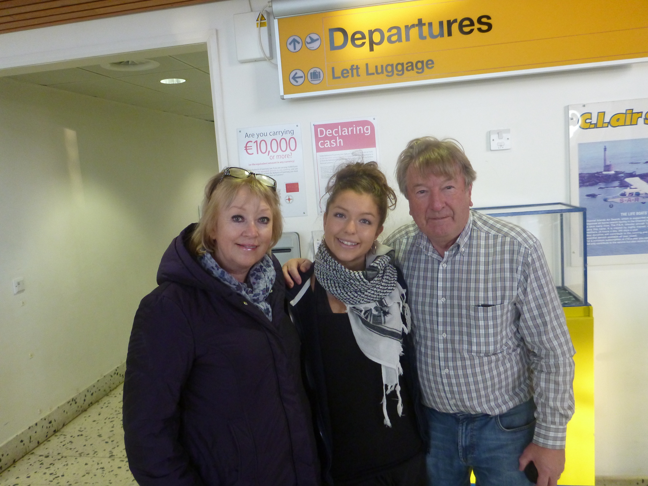 Sarah at Guernsey airport with her parents