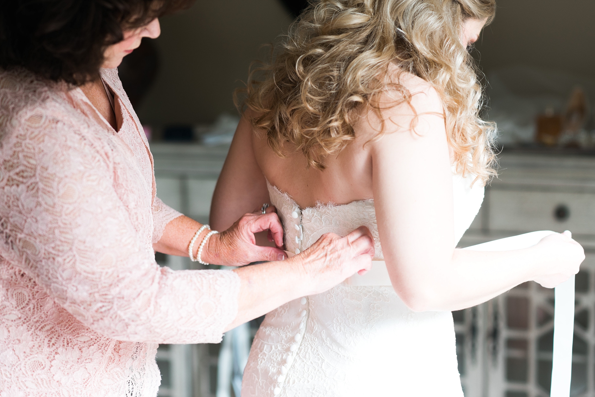 Bride getting in dress | Kyle & Erin | Scarbrough Wedding | Children's Harbor | Laura Wilkerson Photography