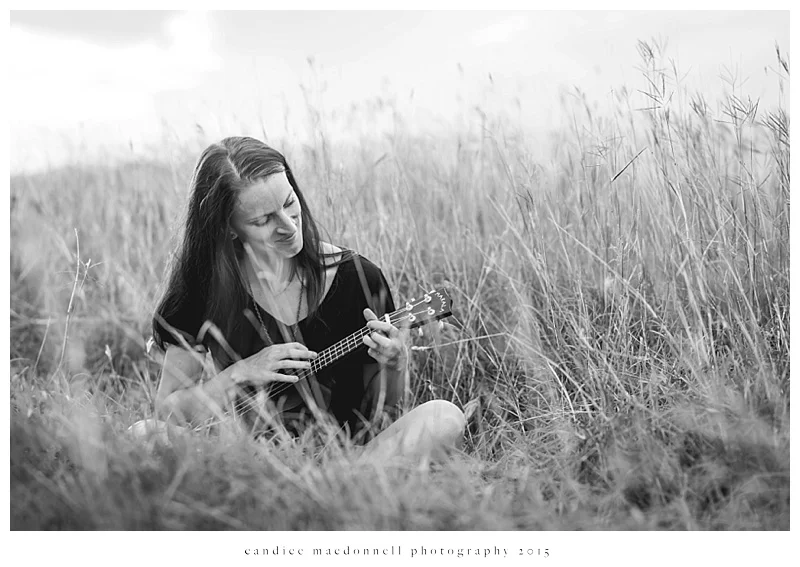 woman playing ukulele in the field © candice macdonnell photography
