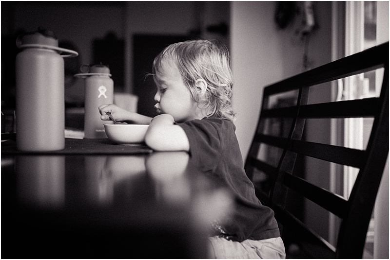 reflection in table child eating cereal lifestyle family photographer