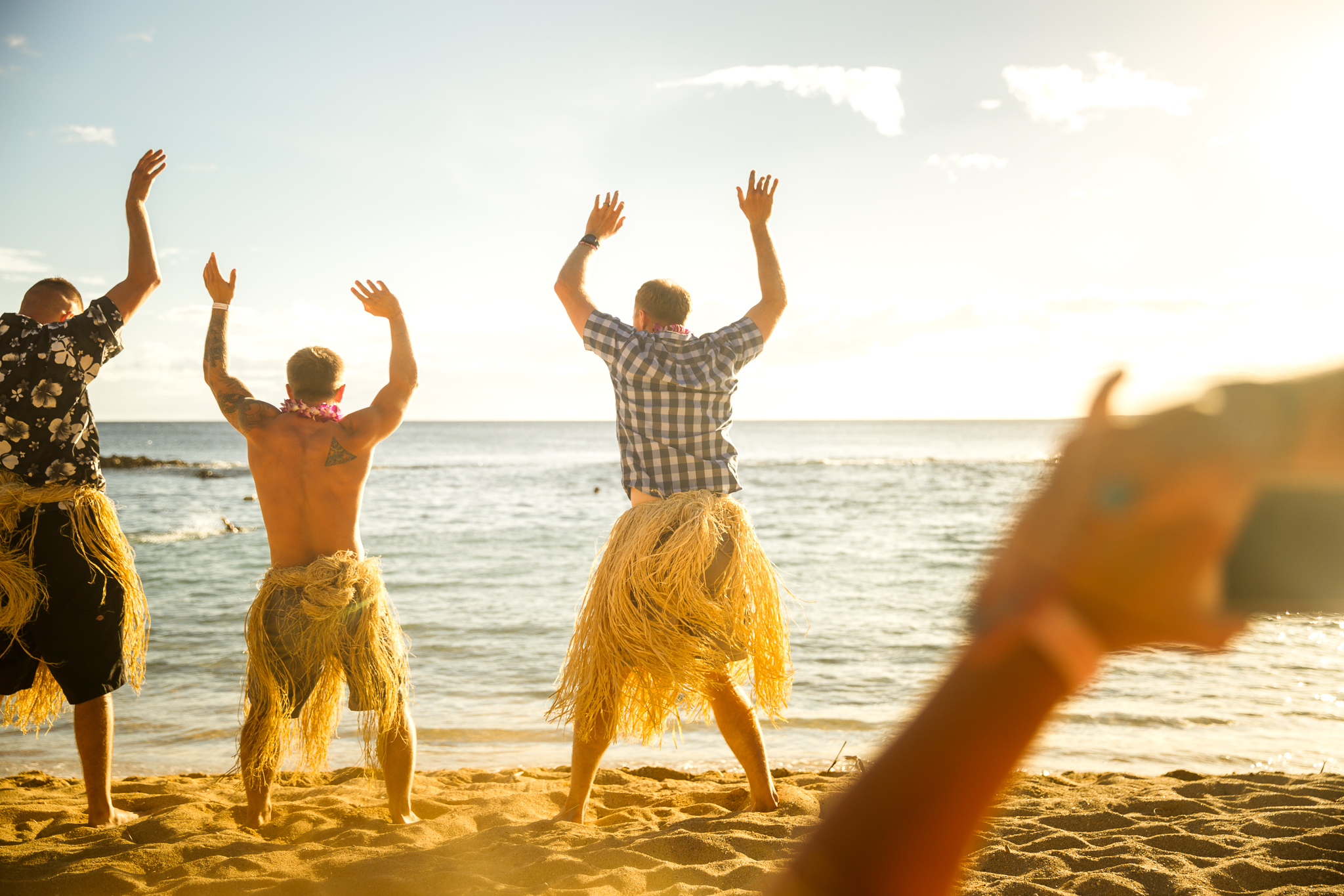 husband hula dancing at luau paradise cove family photographer