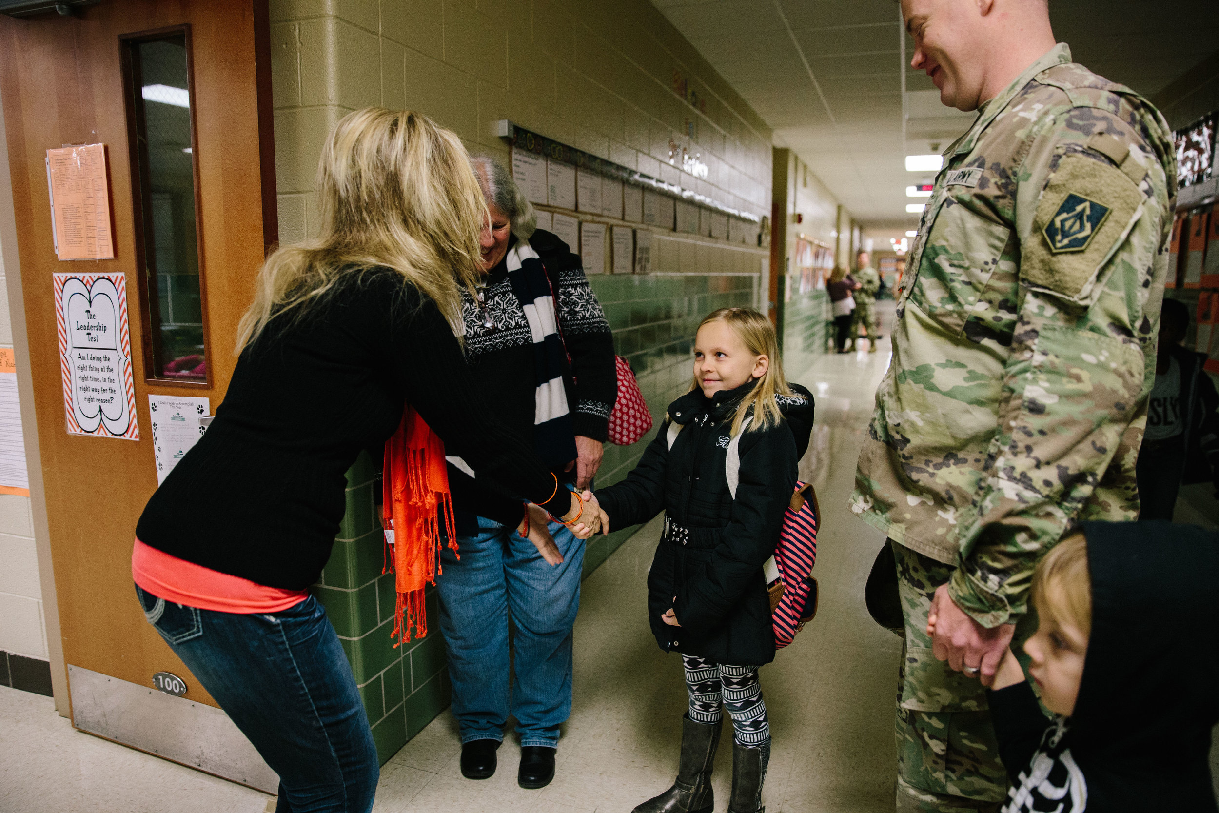 girl meeting her new teacher on first day of school - fort leonard wood documentary photographer