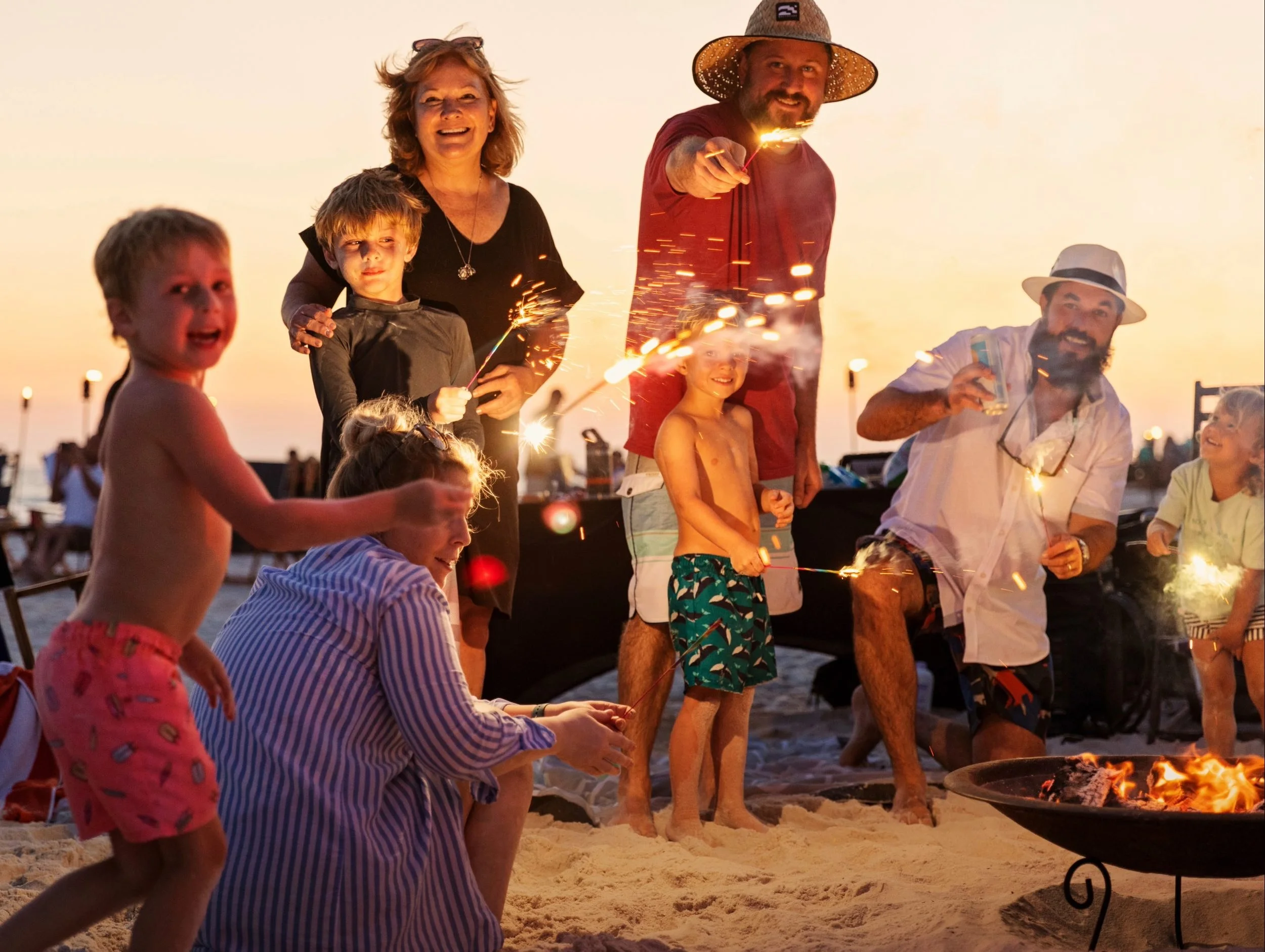 Family enjoying a beach bonfire on 30A