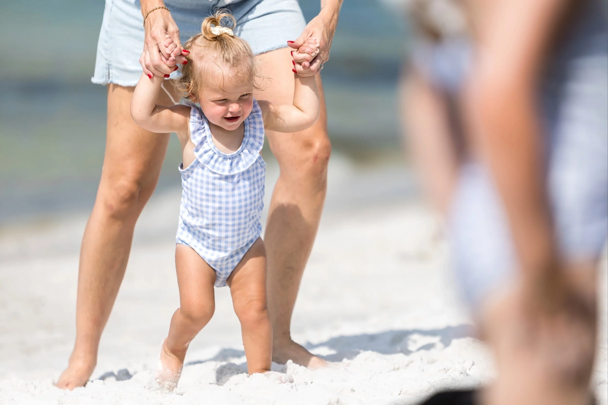 Toddler playing in Watercolor Florida during candid family photography session.