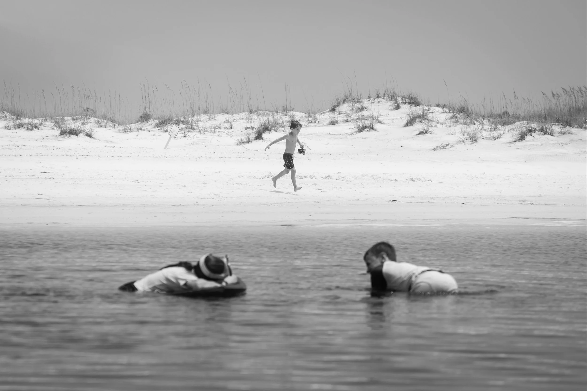 Children playing in Western Lake at Grayton Beach