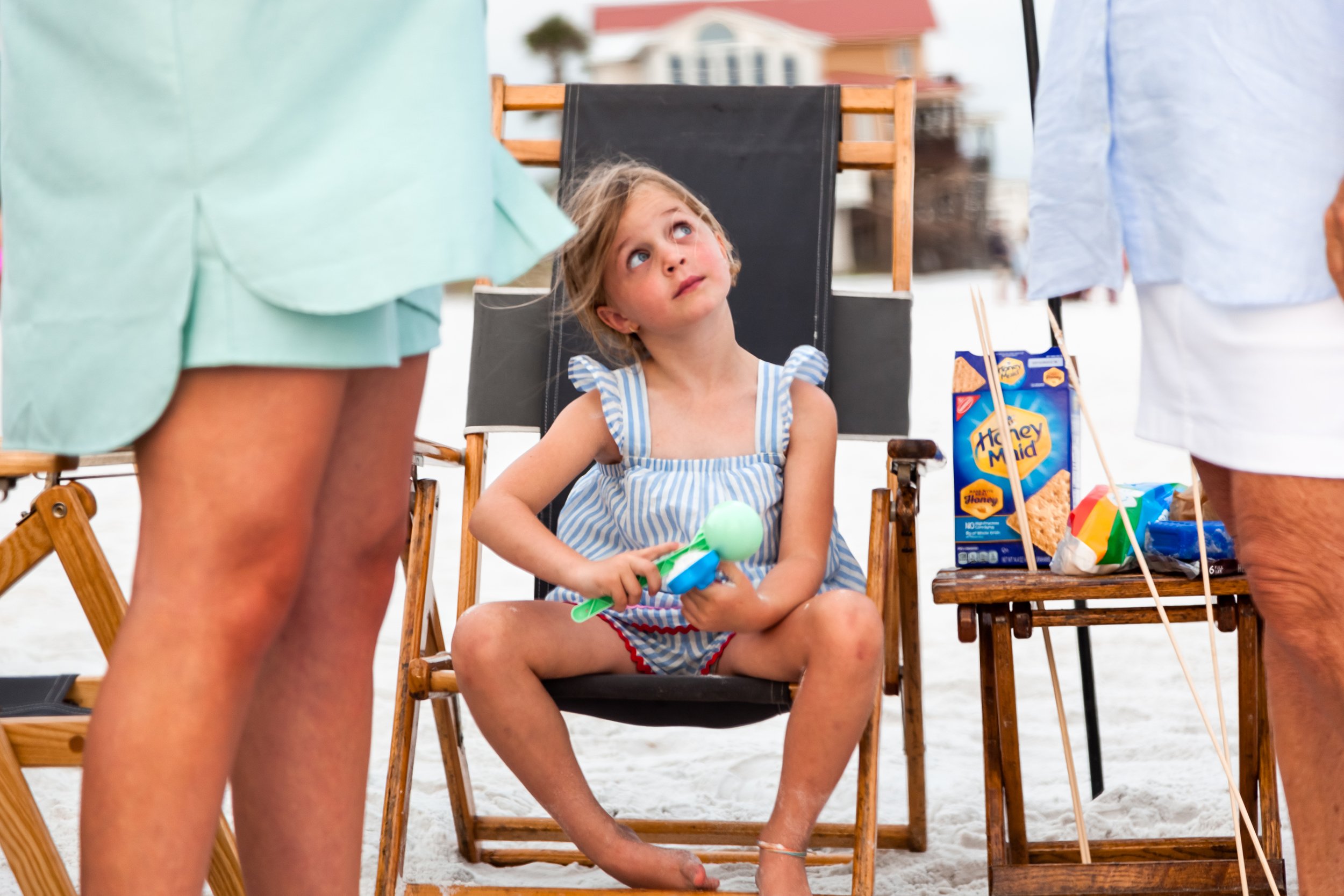 Family hanging out on the beach during a relaxed documentary family photography session on 30A.