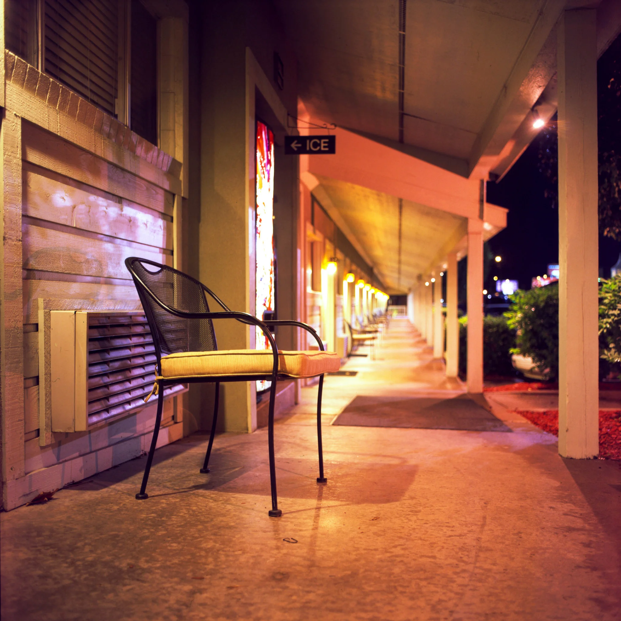 A chair sits outside the vending machine at the motel.