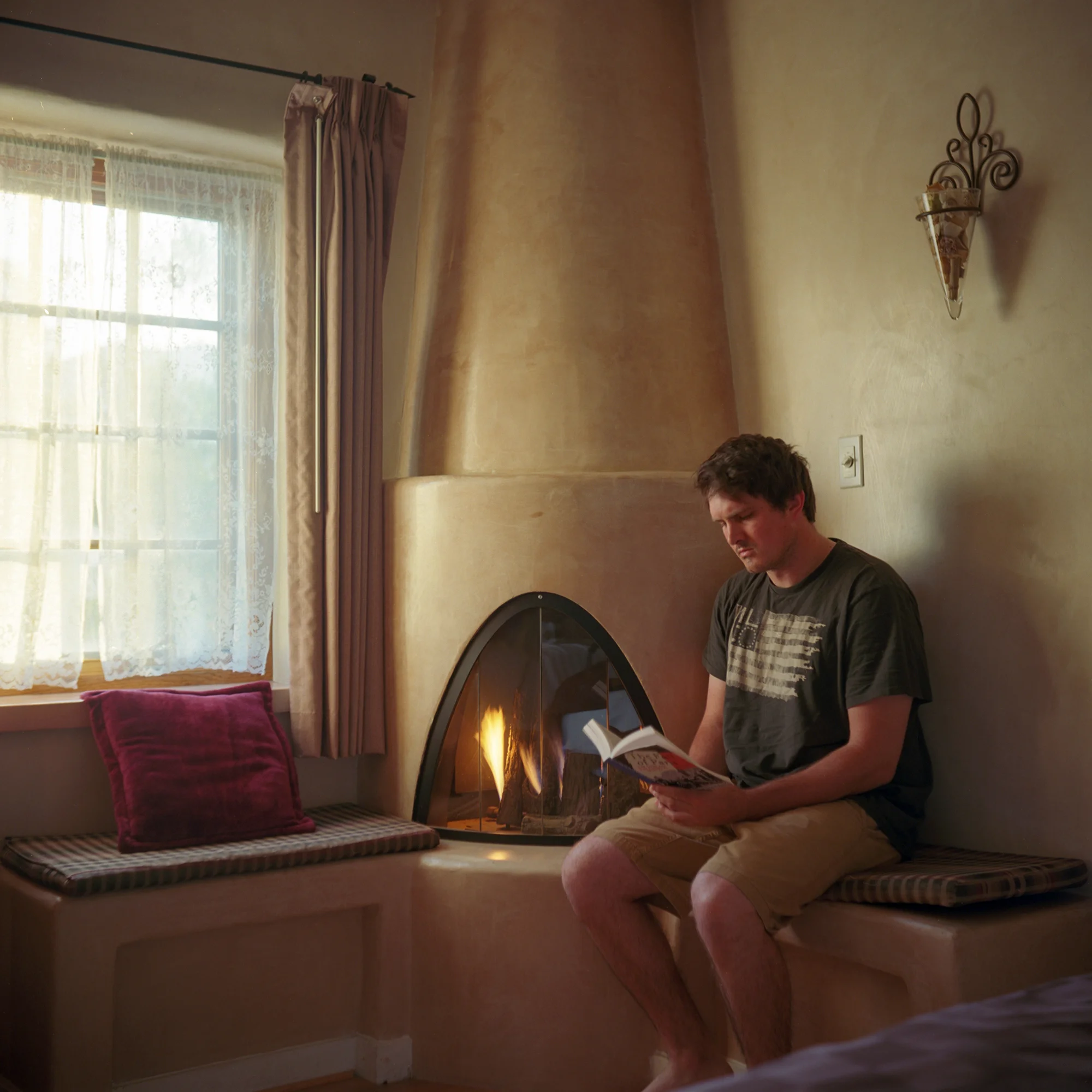 Me fake reading in front of this elaborate fireplace...