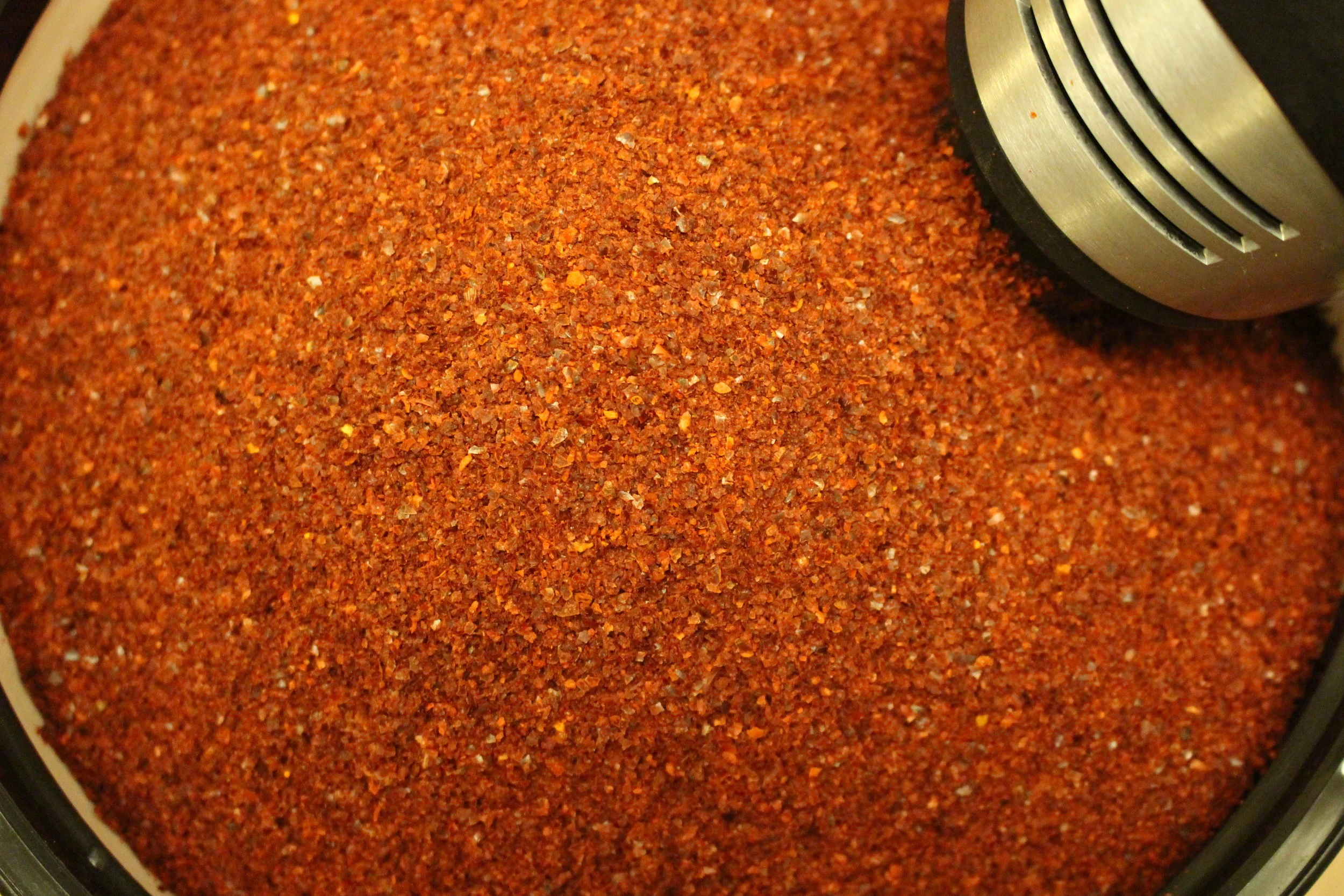 A towering amount of Korean pepper flakes. Many of my customers ask me what differentiates my product from the kimchi that is readily available on Asian market shelves, and I just simple answer: Korean pepper flakes. There is a process of cultivating, curing and processing of Korean peppers in order to bring it to its processed form. The whole process imparts upon the peppers a rounder, earthier tone, with a hint of sweetness on the tonsils at the very end of consumption. This is not something that you can purchase in bulk for cheap at your local wholesales markets