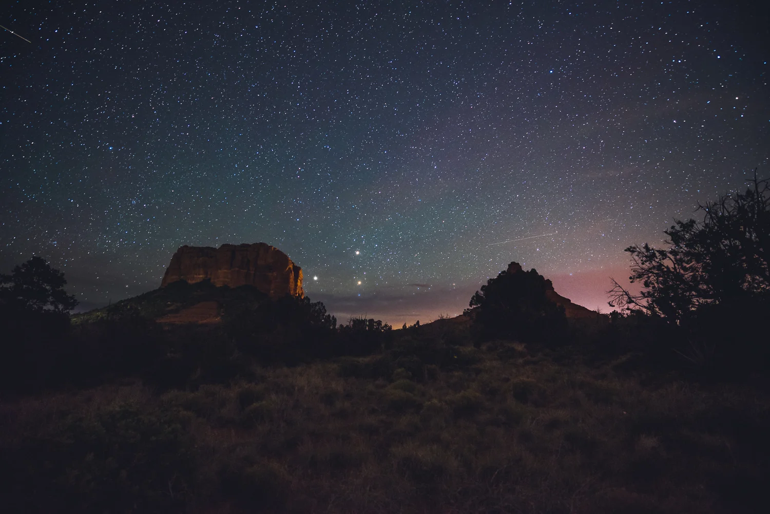 Looking south towards Courthouse Butte (left) and Bell Rock (right). The three bright points to the right of Courthouse Butte are actually Saturn, Mars, and the star Antares