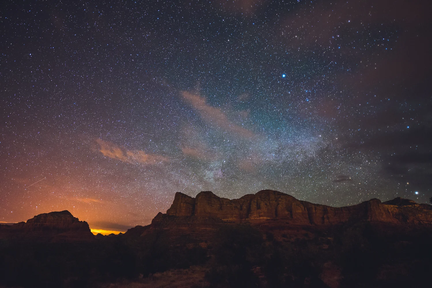 Looking east towards Lee Mountain, you can faintly see the thin white star clusters of the galactic plane as clouds begin to obscure the sky