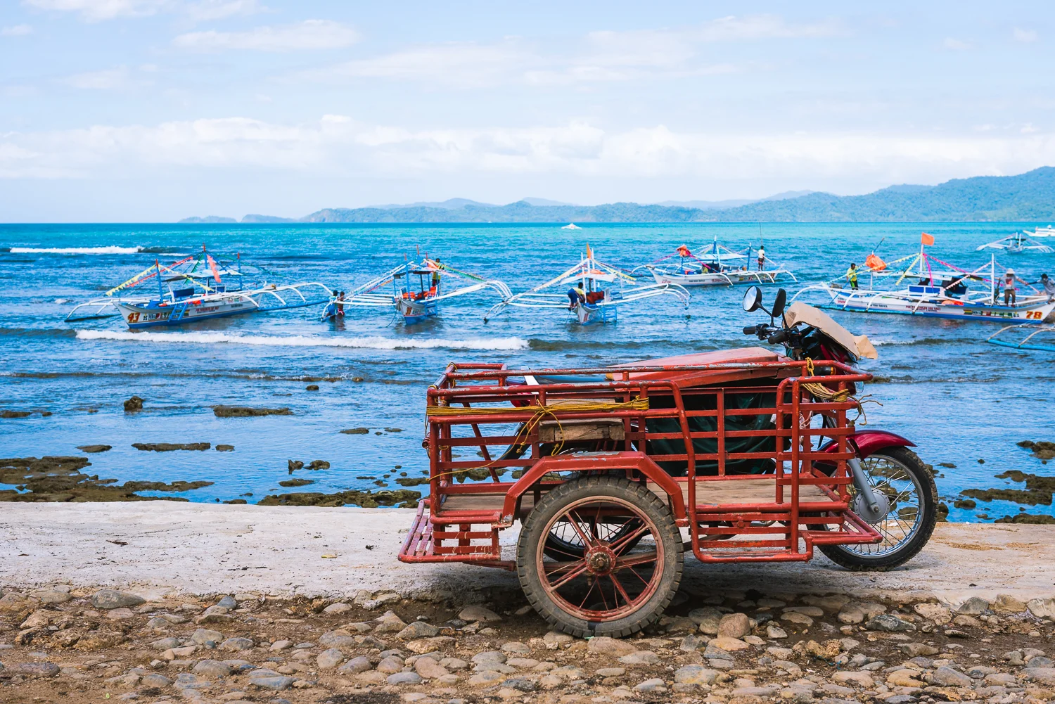 When visiting Philippines, we usually make time to escape the crowds and chaos of Manila by visiting other places within the Philippine islands. This year, we visited the island of Palawan. This shot was taken at the small port town of Sabang while waiting for our ferry to the underground river. This is one of my favorite shots from Palawan because it shows the beauty and blueness of Palawan waters, while showcasing a staple of Filipino transportation, the tricycle. 