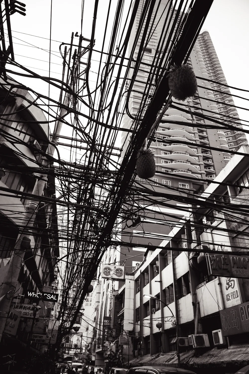 During one of the last days in the Philippines, we visited the Chinatown section of Manila. Like most of the Metro Manila region, Chinatown was extremely crowded and chaotic. The infrastructure was no different. Walking through Chinatown, one of the things I noticed when looking past the many fruit stands, bakeries, and Chinese restaurants was this mangle array of power lines. Just like the Philippines itself, this section of wires was crowded, chaotic, and unorganized, yet somehow still manages to get the job done. 