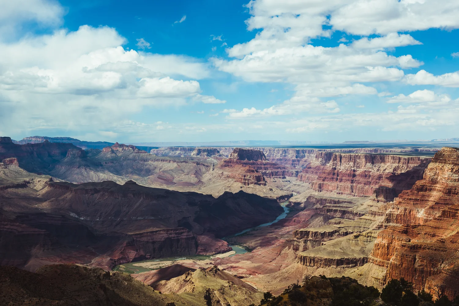 The Grand Canyon is one place where photographs cannot capture the experience of actually seeing it for yourself. Even though the shot above is one of my favorites of our trip, it still does not compare to actually being there. The photo above was taken towards the end of our 12 hour visit at Desert View Point on the east end of the park. It showcases many of the things that make the canyon so beautiful; the layers of rock carved away by the Colorado River, the river itself running through the middle of the frame, the midday clouds casting shadows over the vast space. Looking at a map later on, I discovered the most distant rock formations along the horizon of the picture were more than 40-50 miles away from where we were standing. Visiting the Grand Canyon has left a lasting impression on me. I hope to visit again to explore even further. 