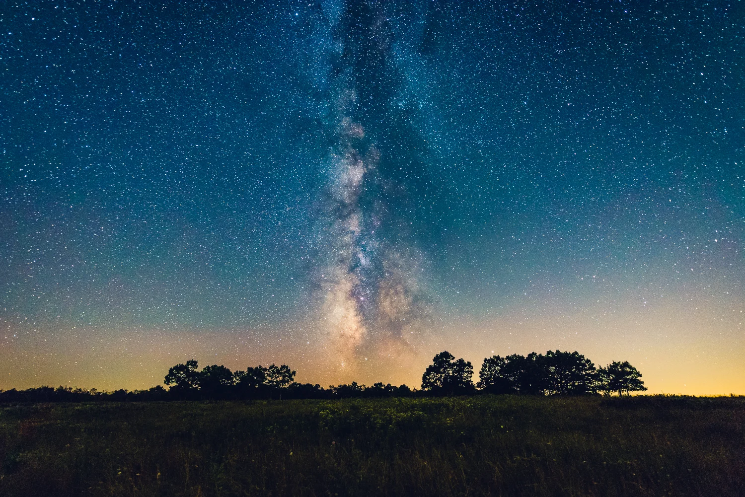 Shenandoah National Park was the last place me and Ashley got to stargaze at in 2016 back in late August. During the later summer months, Milky Way galactic plane is not only visible earlier in the night but also appears to originate from the horizon at a 90 degree angle. This shot was one of my favorite stills from our trip as the Milky Way bisects the frame surrounded by two groups of trees. If you are on the east coast, I would highly recommending checking out Big Meadows within Shenandoah National Park for some stargazing. You will not be disappointed. 