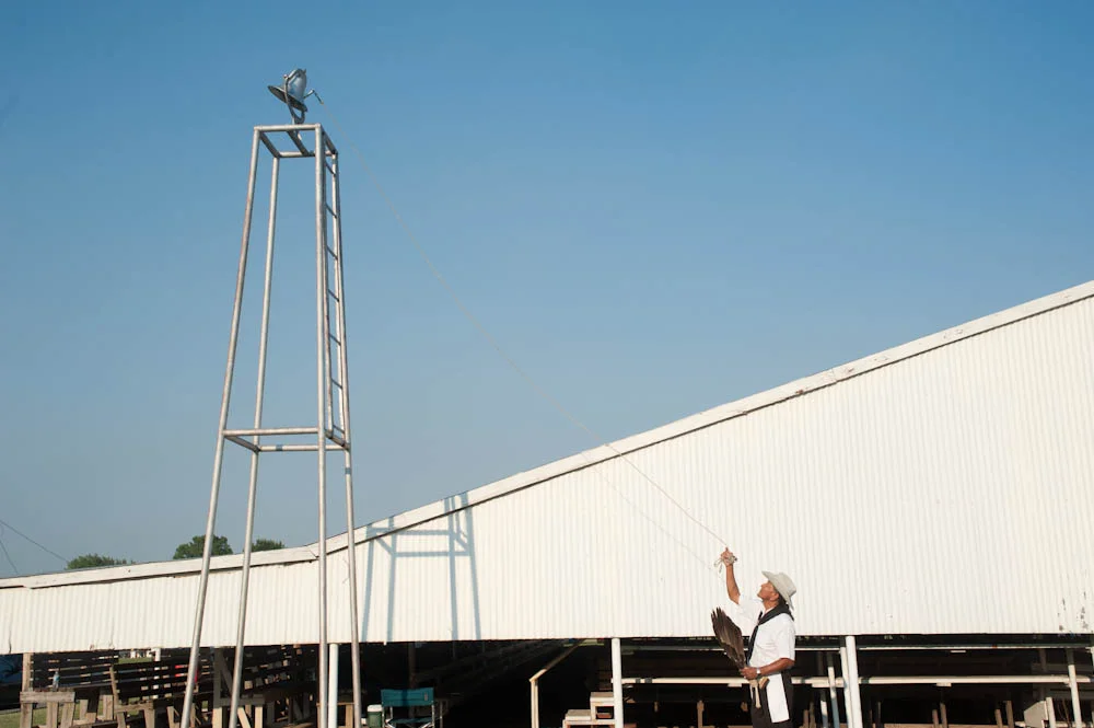 (June 2012) Member of the Osage community rings the bell signally the beginning of the Pawhuska "I'n-Lon-Schka" annual ceremonial dance. 