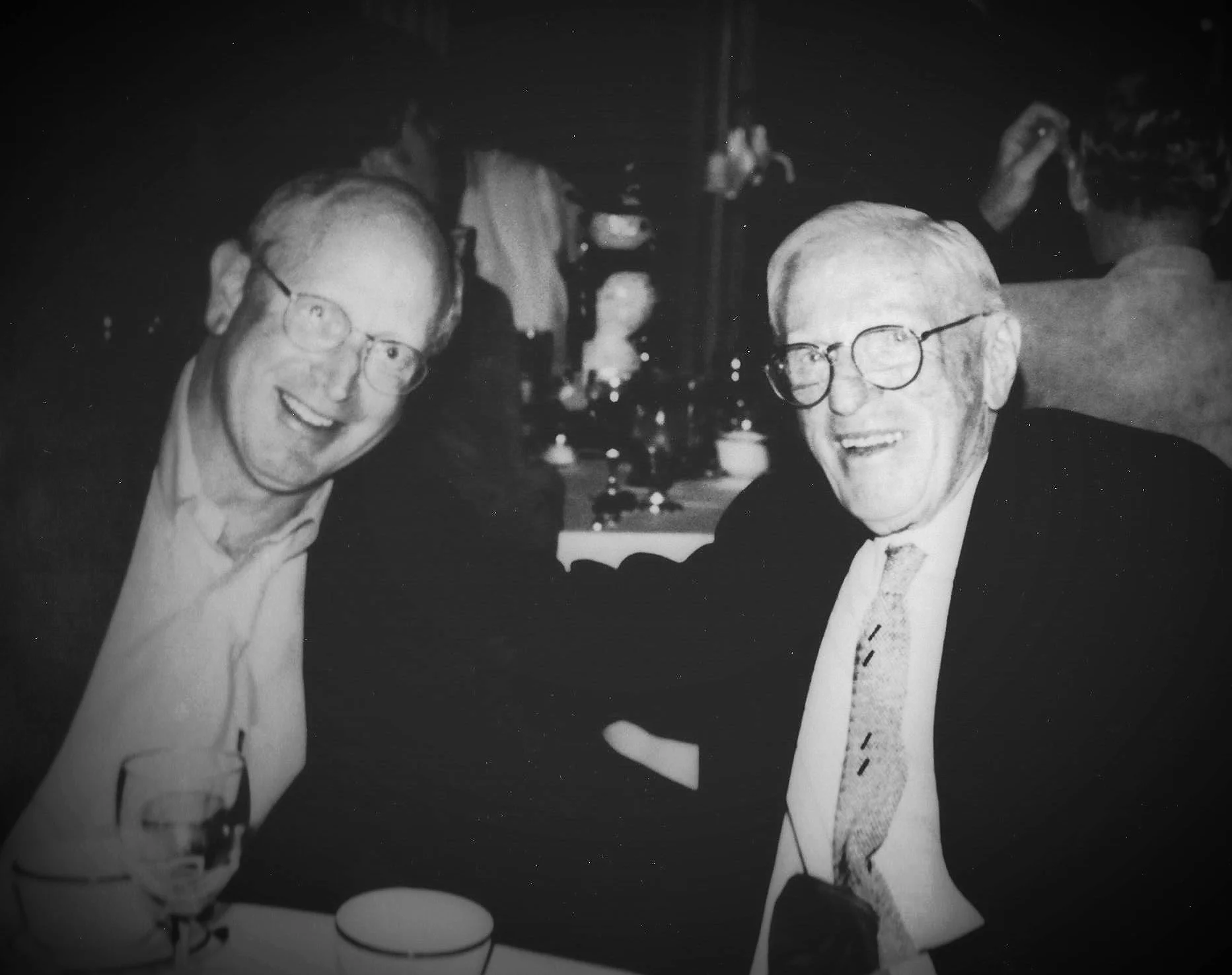 Current President and CEO Lonny Gold and former President and CEO Red Adams enjoying a drink at a charity event.