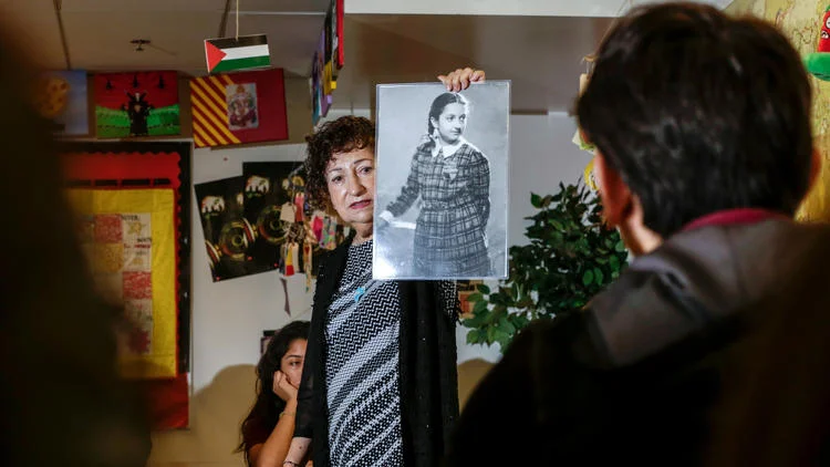 Gabriella Karin, who spent part of World War II in hiding from the Nazis, speaks to students at Animo Ralph Bunche High School about her experiences. (Irfan Kahn / Los Angeles Times)