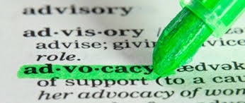 Close up picture of a dictionary page with the word "advocacy" being highlighted in green with a highlighter pen