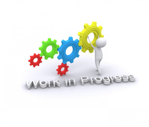 Illustration of a white 3-d stick figure working on a series of multicolored gears, with "Work in Progress" in letters underneath