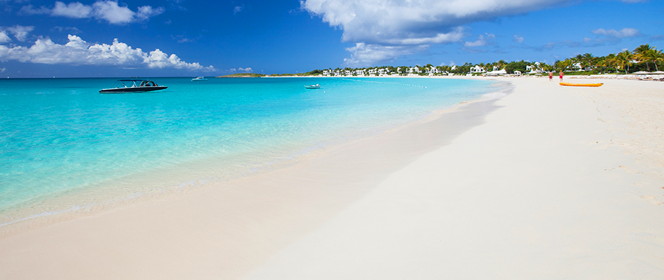 Photo of a smooth sandy beach by the ocean
