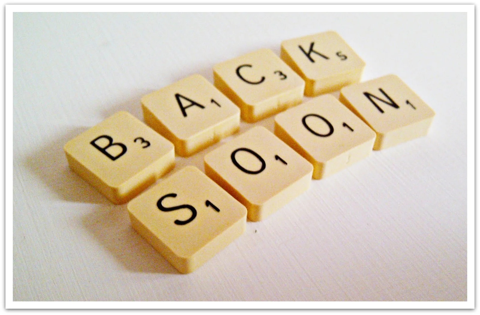 Picture of Scrabble tiles spelling out "Back Soon"