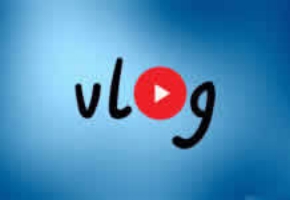 "Vlog" logo on a mixed dark and light blue background