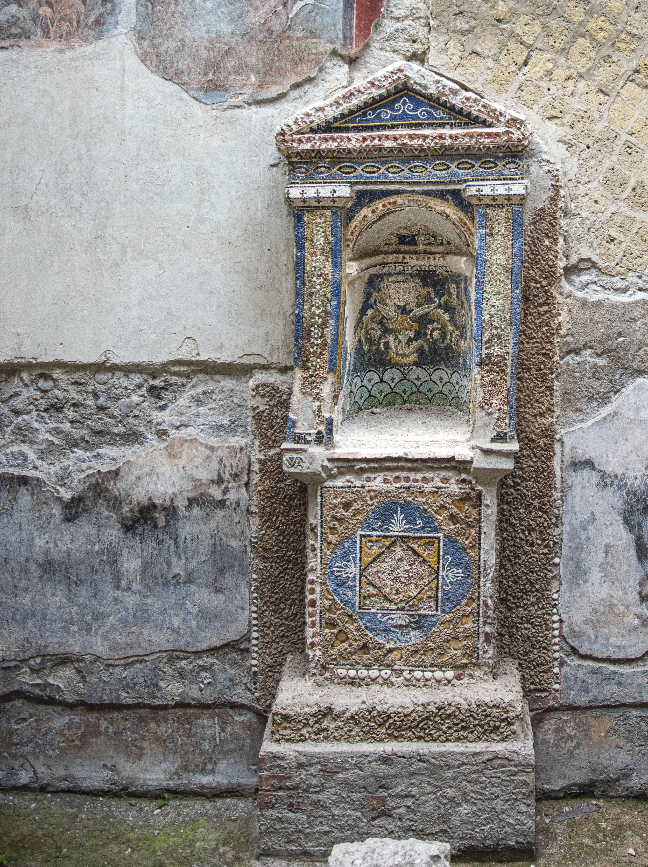 Casa della Schletro - mosaic laraium - a shrine to the guardian spirits of a Roman household where family members performed daily rituals to guarantee the protection of these domestic spirits.