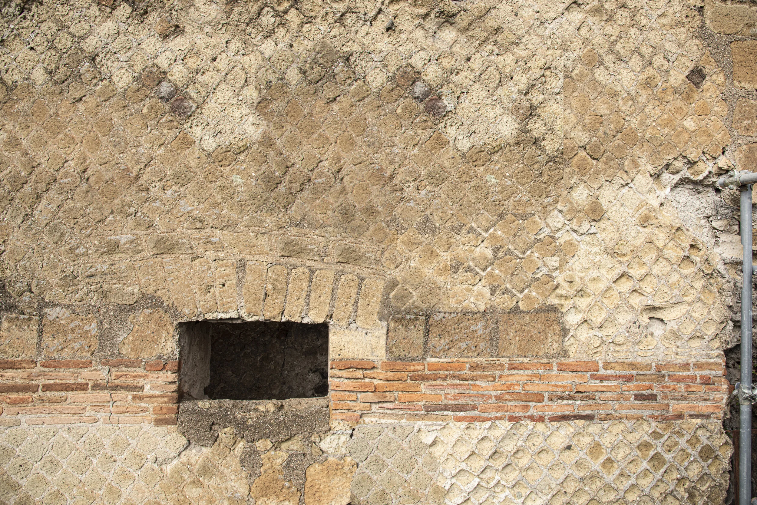 Opus mixtum ("mixed work") was an ancient Roman construction technique consisting of a mix of opus reticulated ("net work") and at the angles and the sides of opus latericium ("brick work").          