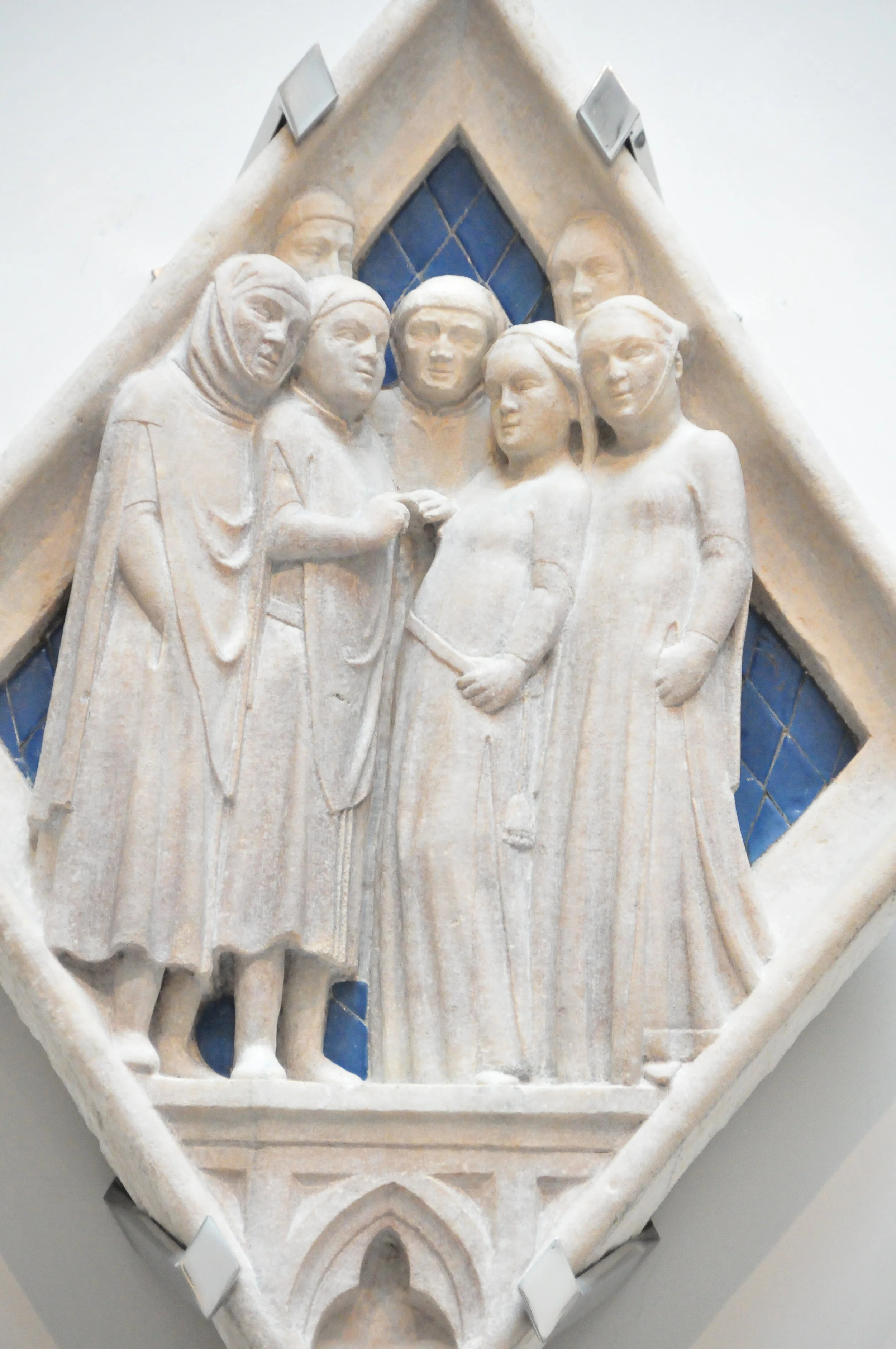 "Matrimonio" (1337-1341), marble and maiolica, by Gino Micheli da Castello 