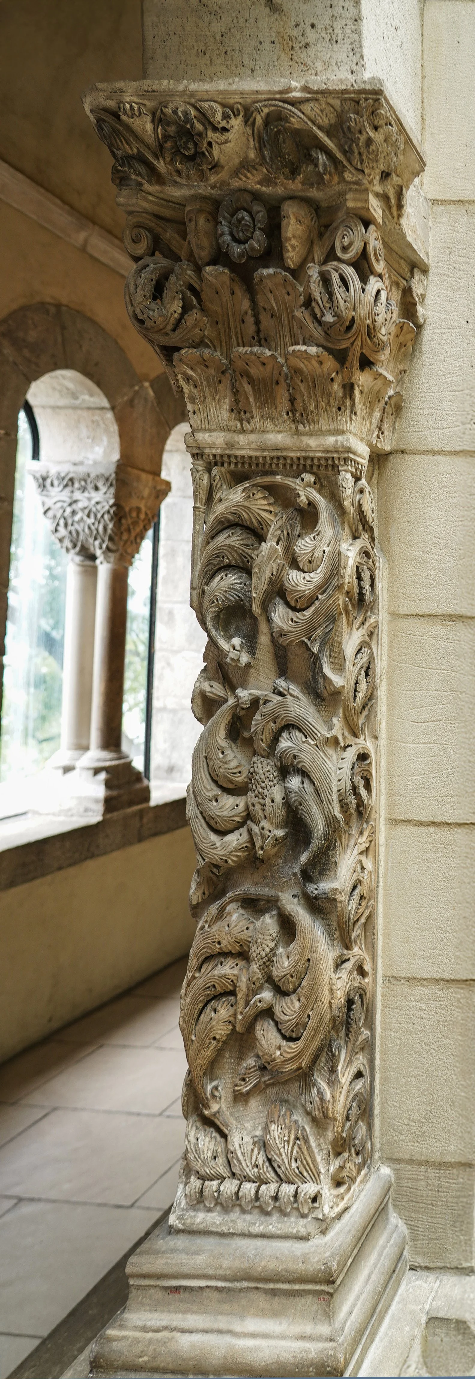 Pilaster with naturalistic acanthus leaves and blossoms, the carving accented with drillwork.