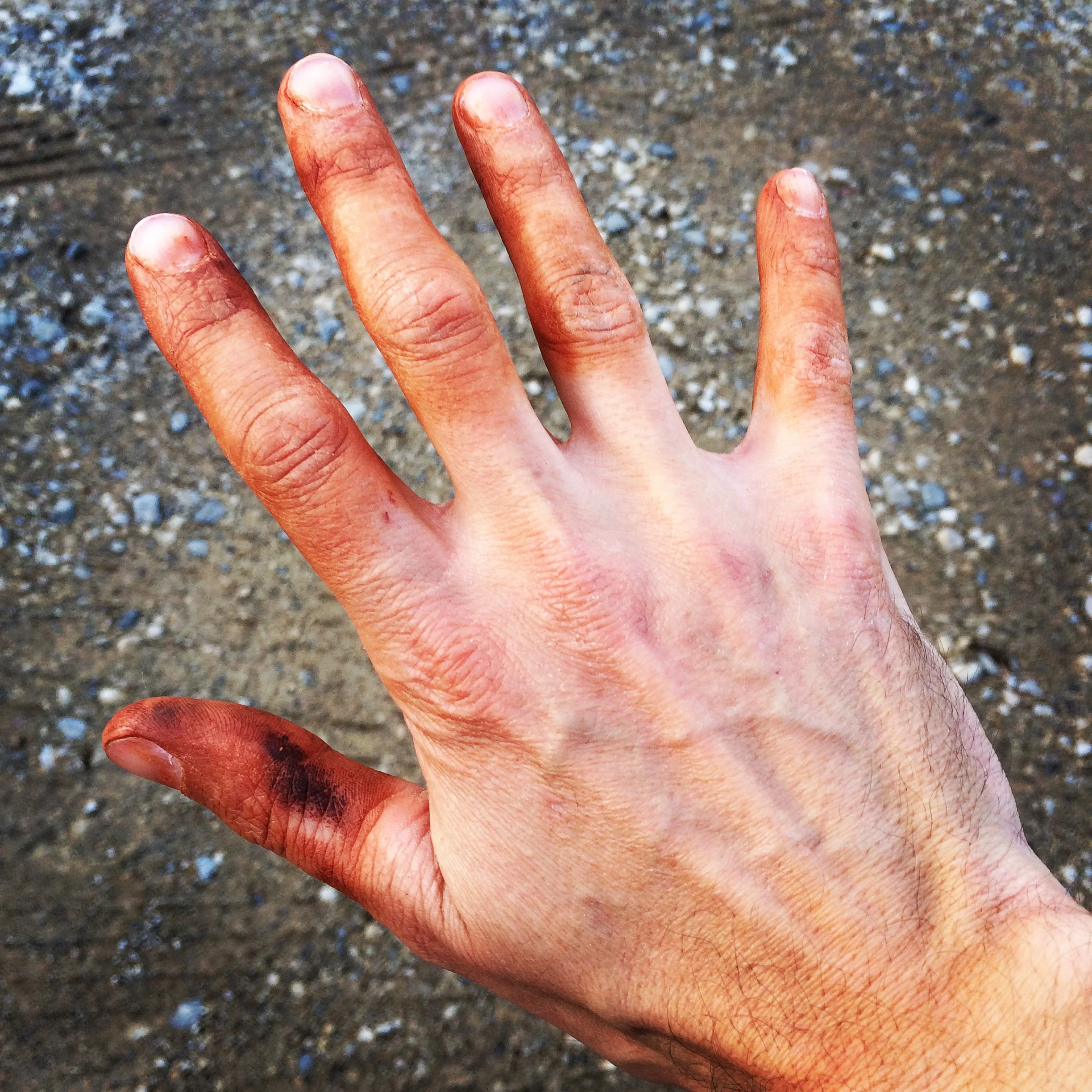 A red clay hand tattoo is the sign of a fun day of gravel and mud racing. 