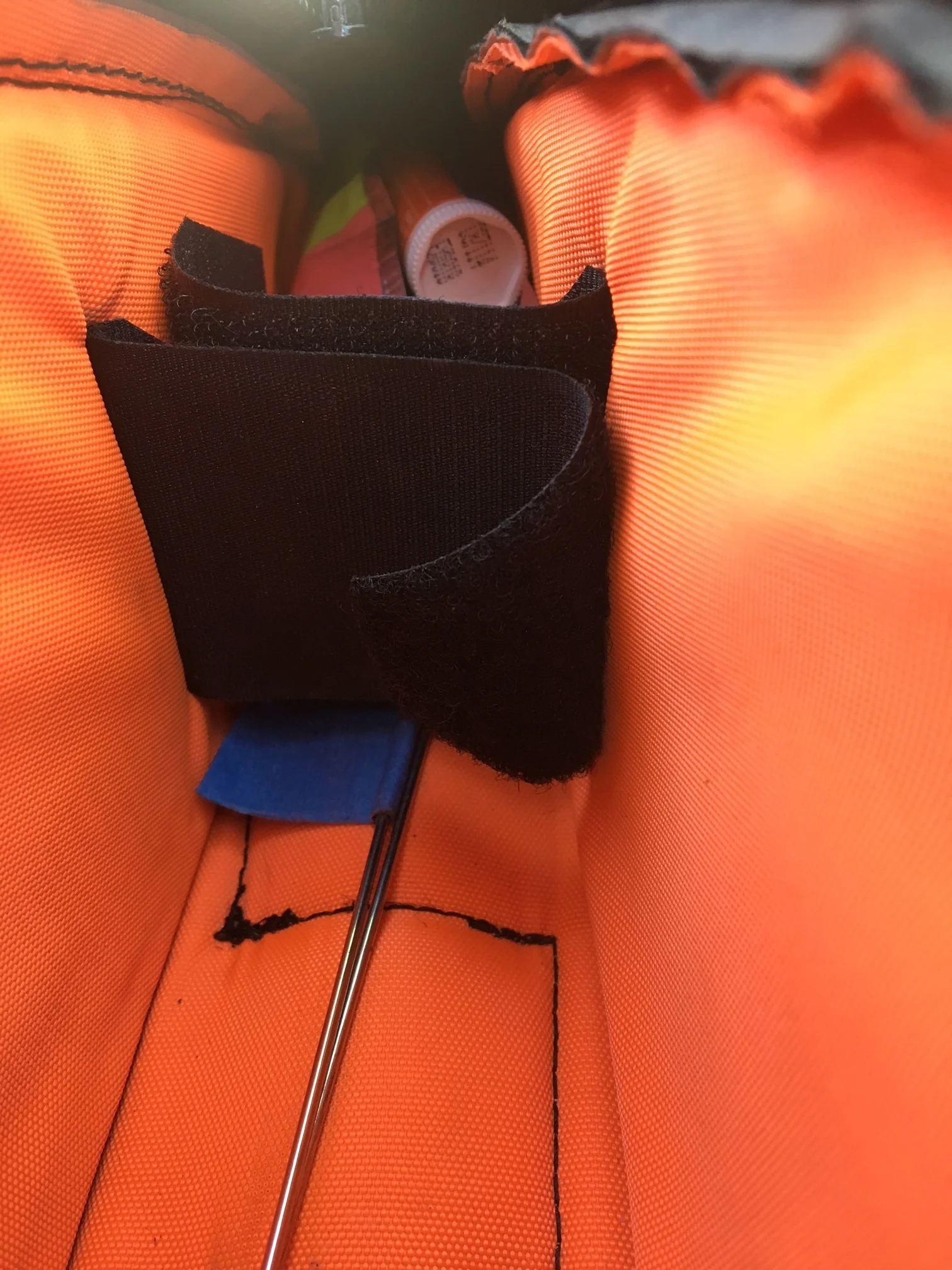 A divider keeps items from shifting around and allows me to widen or narrow the bag somewhat. As well as food, spare spokes are kept inside this bag. 