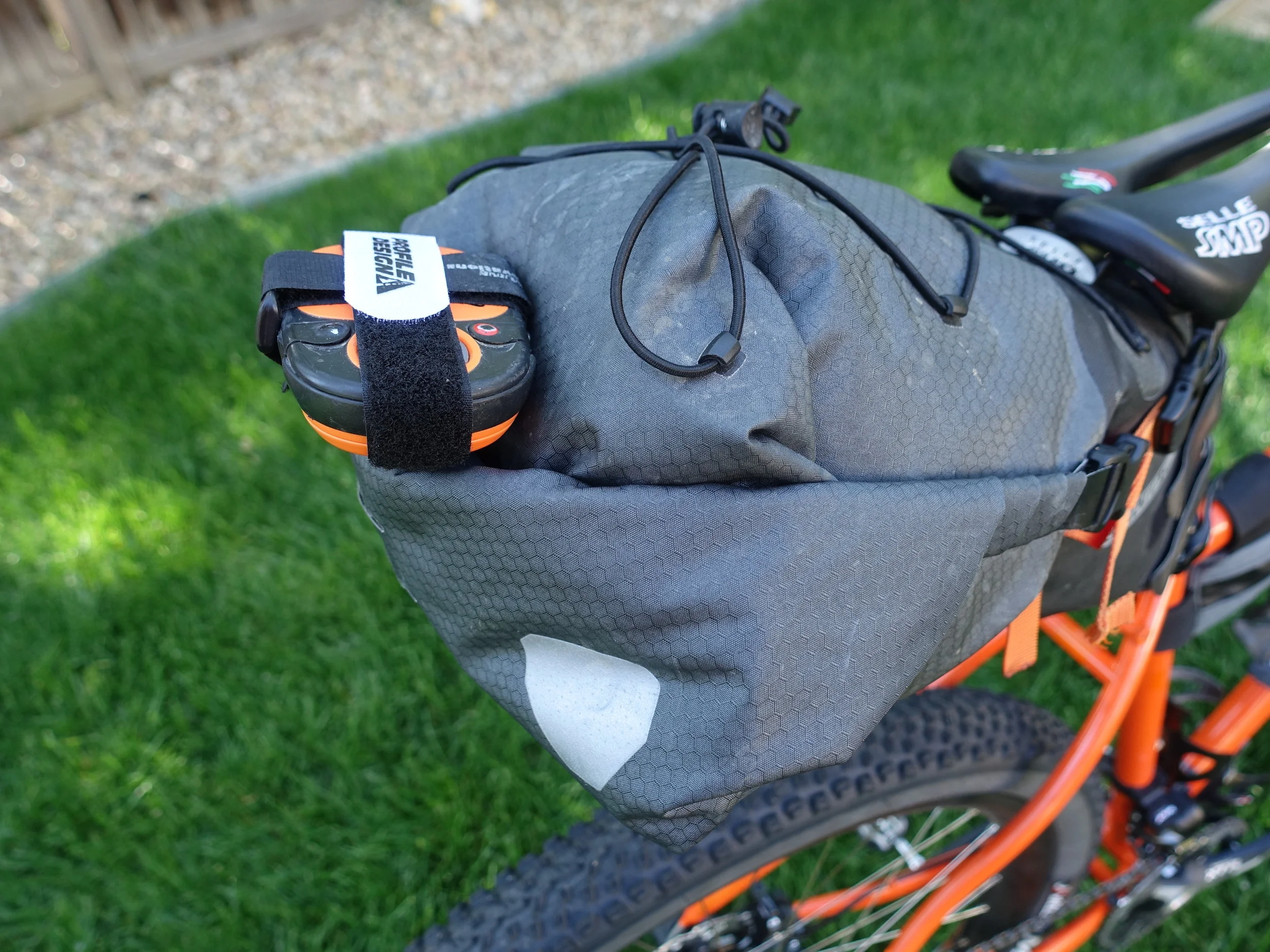 Using the light mounting points on the Ortlieb Seat Pack to mount my Spot Tracker. With an old Genuine Innovations Big Air mounting block and a couple Velcro straps I have a nice, secure way to carry it and with a good line of sight to the sky.