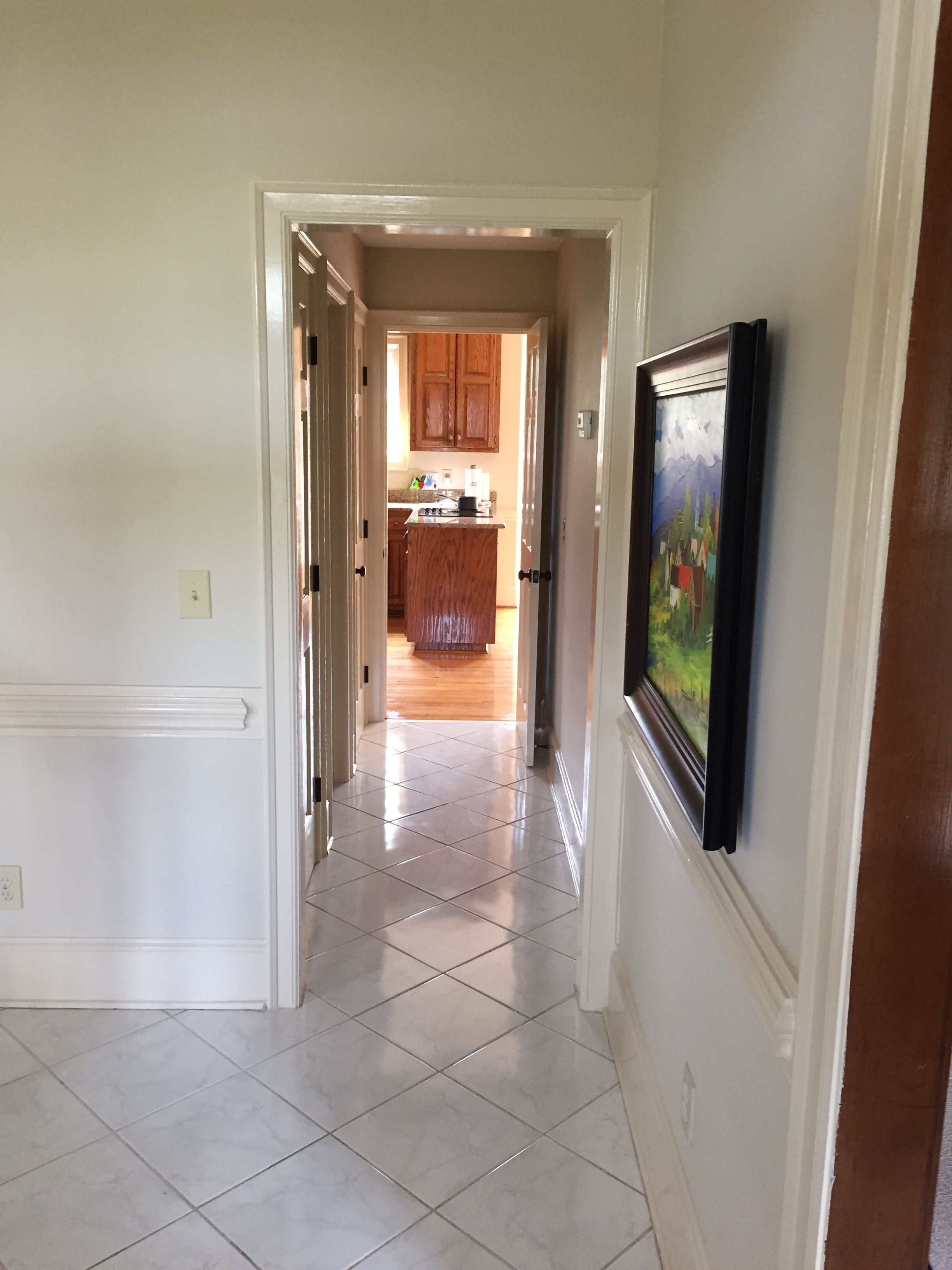 Foyer looking down the hallway that connects to the kitchen.