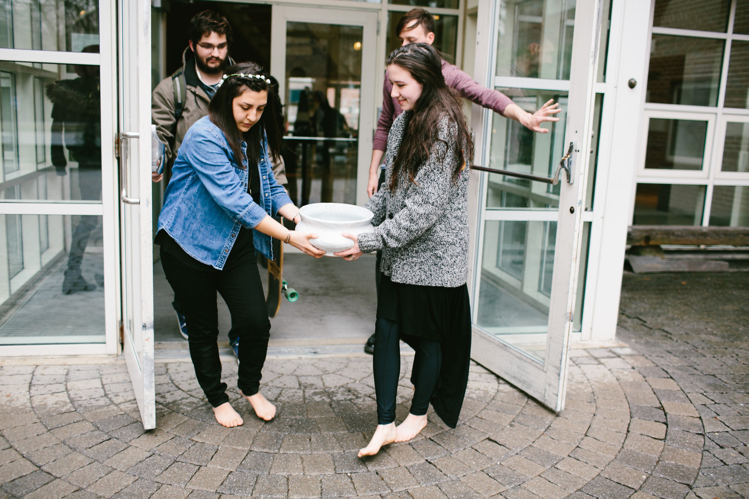 Artists barefoot carrying ritual low bowl through Boston MA Madeleine Kobold photography